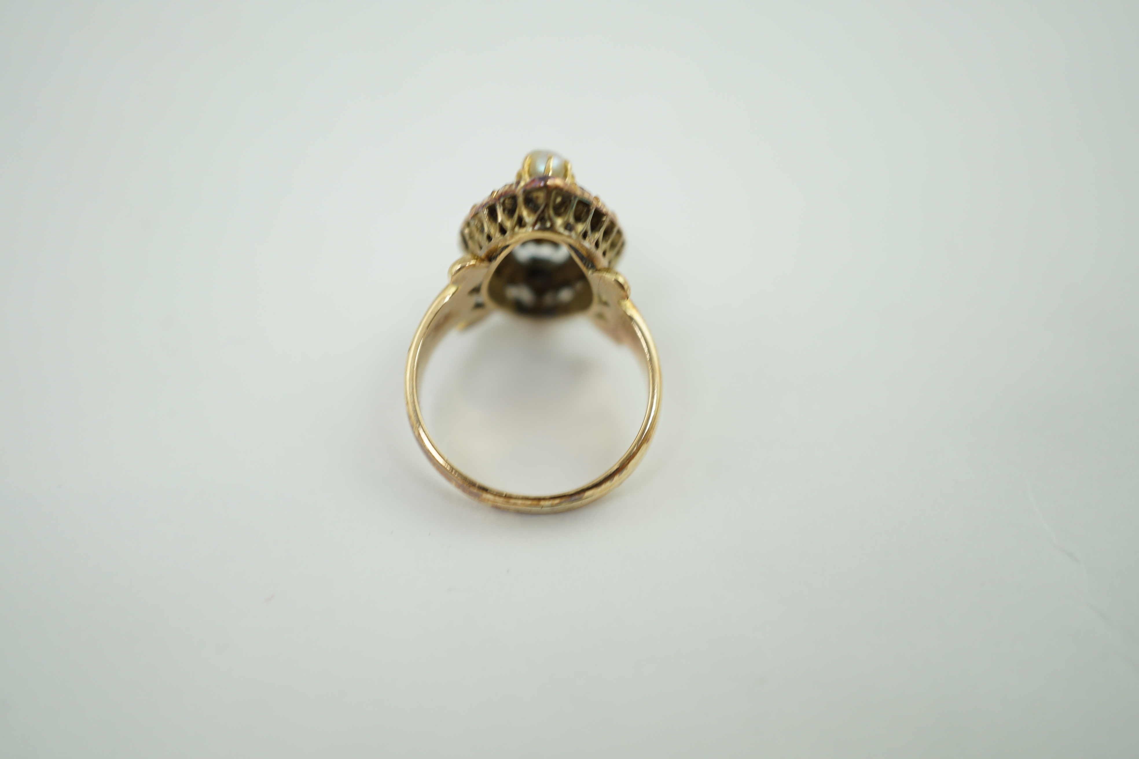 An antique gold, button pearl, emerald and diamond set navette shaped cluster ring